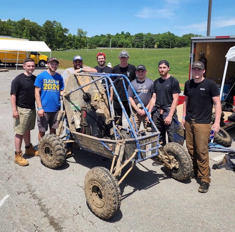 Golden Bear Racing team with the car at Baja SAE Tennessee Tech 2022
