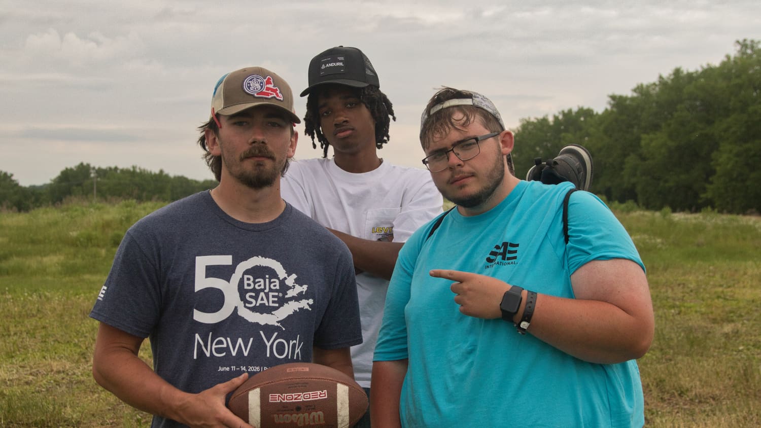 Team members hanging out with a football between sessions